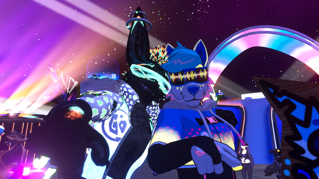 A friend and I posing at Club FYNN with colorful lights in the background.